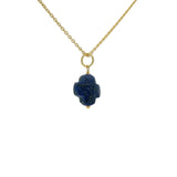 Gold necklace and stone clover