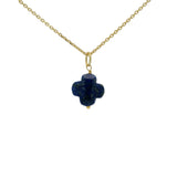 Gold necklace and stone clover
