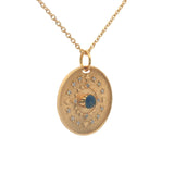 Gold necklace with eye stone and zircon medal
