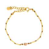 Bracelet with golden rods and natural stones