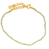 Bracelet doré noeuds en cordon bleu avec perles dorées