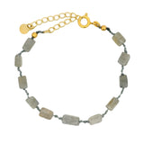 Golden bracelet with rectangular stones on cord
