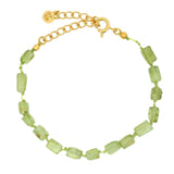 Golden bracelet with rectangular stones on cord