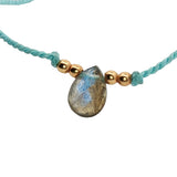 Bracelet cordon et pampille pierre