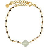 Golden clover bracelet with faceted stone