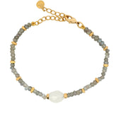 Bracelet with faceted stones and golden discs