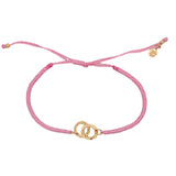 Bracelet cordon rose menottes dorées