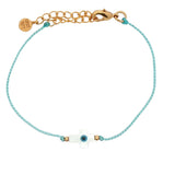 Bracelet doré cordon turquoise croix en nacre avec oeil