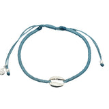 Bracelet sur cordon bleu avec cauri en argent 925