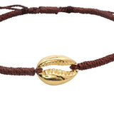 Bracelet sur cordon marron avec cauri doré