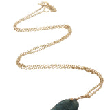 Gold necklace and natural stone fish