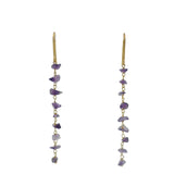Golden earrings and raw stones