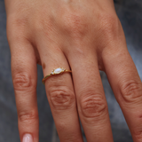 Golden ring with stone and two zircons