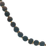 Necklace with wooden beads and gold discs