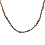 Golden necklace with elongated coconut wood beads