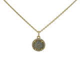 Gold necklace with round stone and zircon pendant