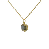 Gold necklace with round stone and zircon pendant