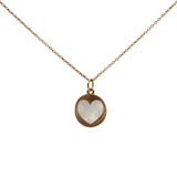 Gold necklace with textured heart medal and stone