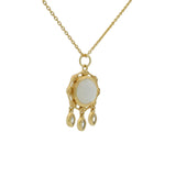 Gold necklace with round stone pendant and tassels