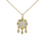 Gold necklace with round stone pendant and tassels