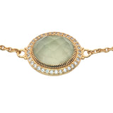 Golden bracelet with faceted oval stone and zircons