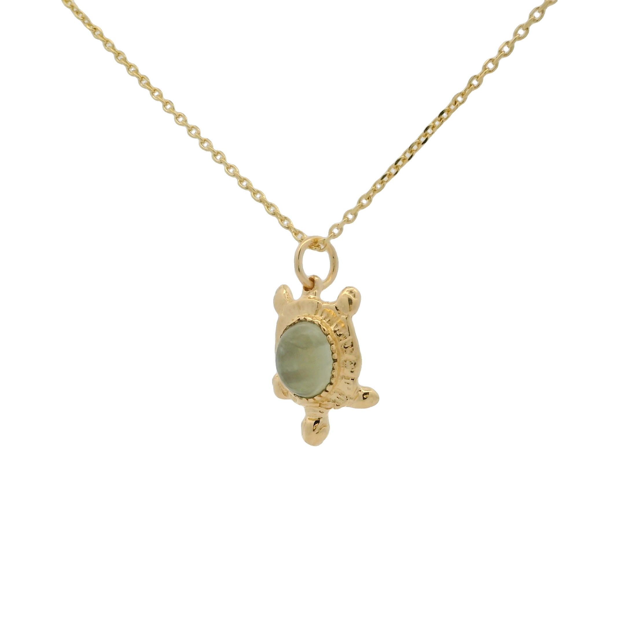 Gold necklace and turtle with cabochon stone