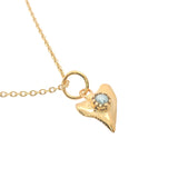 Gold shark tooth and stone necklace