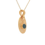 Gold necklace with engraved flower and stone pendant