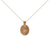 Gold necklace with engraved flower and stone pendant
