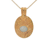 Gold necklace with engraved flower and stone pendant