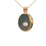 Gold necklace with engraved flower and stone pendant
