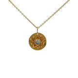 Gold necklace with star and stone medal