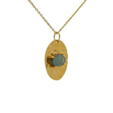 Gold necklace with hammered pendant and flat stone