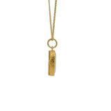 Gold necklace with hammered stone setting