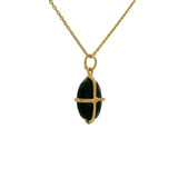 Gold necklace with gold cage stone pendant
