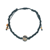 Bracelet doré cordon noir avec perle africaine
