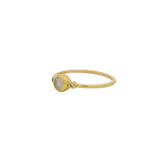 Thin ring with round stone and zircons