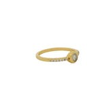 Golden ring with round stone and zircons