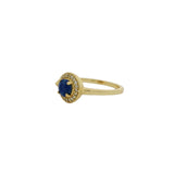 Golden ring with round stone and zircons
