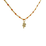 Collier doré tubes avec onyx rouge et trèfle zircons blancs 40cm
