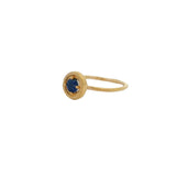 Hammered gold ring with small round stone