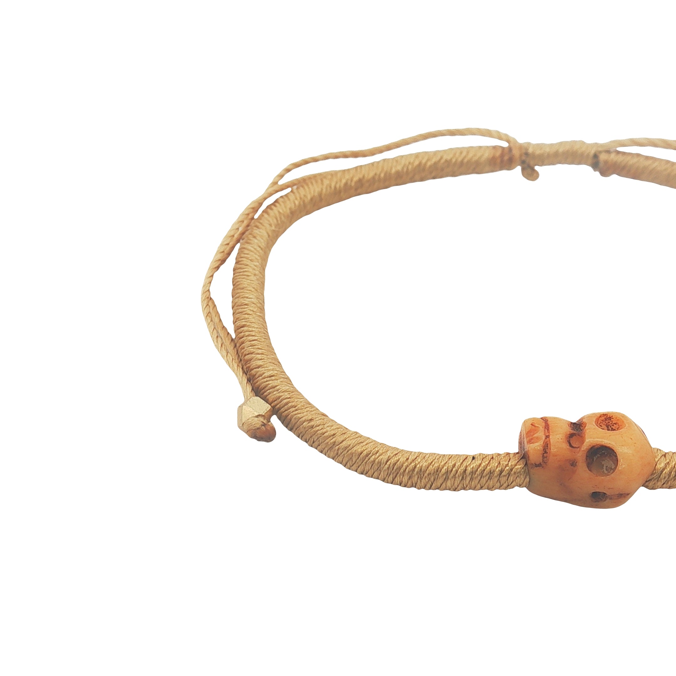 Bracelet cordon doré tête de mort beige