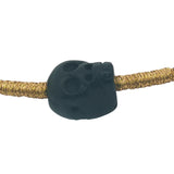 Bracelet cordon noir et doré tête de mort noire