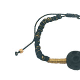 Bracelet cordon noir et doré tête de mort noire