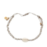 Bracelet doré cordon beige avec cauri naturel