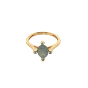 Golden ring with oval stone and 4 zircons