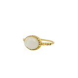 Bague dorée pierre ovale facettée et zircons