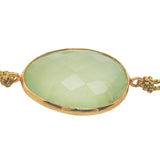 Gold cord bracelet with faceted stone