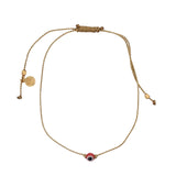 Bracelet doré fil fin doré avec oeil rouge