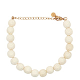 Bracelet doré avec perles en os
